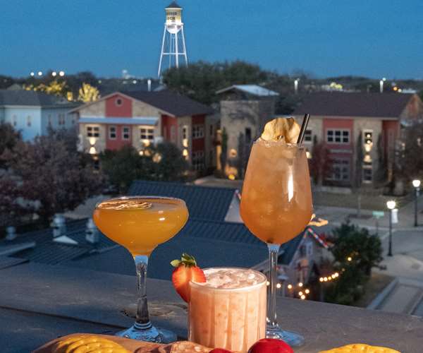 Assorted cocktails overlooking the skyline