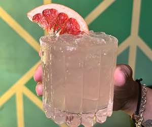 Delicious cocktail with fruit garnish